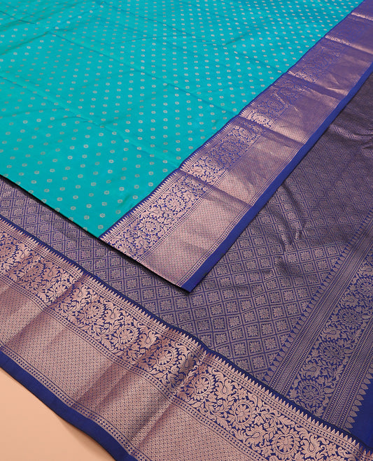Blue zari buttas silk saree, contrast border of rekku, kodi visiry, and jaal designs, and zari-rich jaal pallu