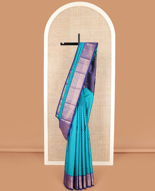 Blue zari buttas silk saree, contrast border of rekku, kodi visiry, and jaal designs, and zari-rich jaal pallu