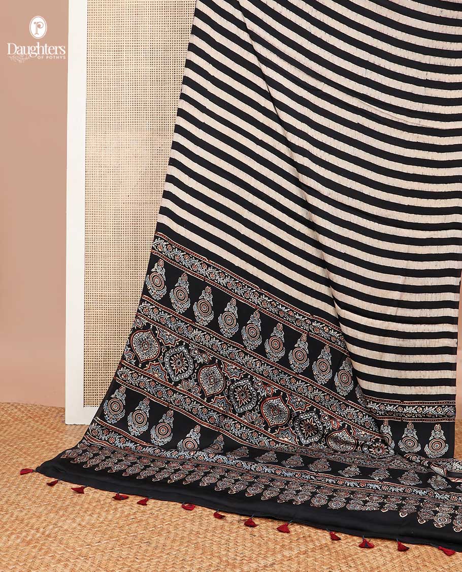 Borderless black and white striped modal silk saree with ajrakh style floral design pallu