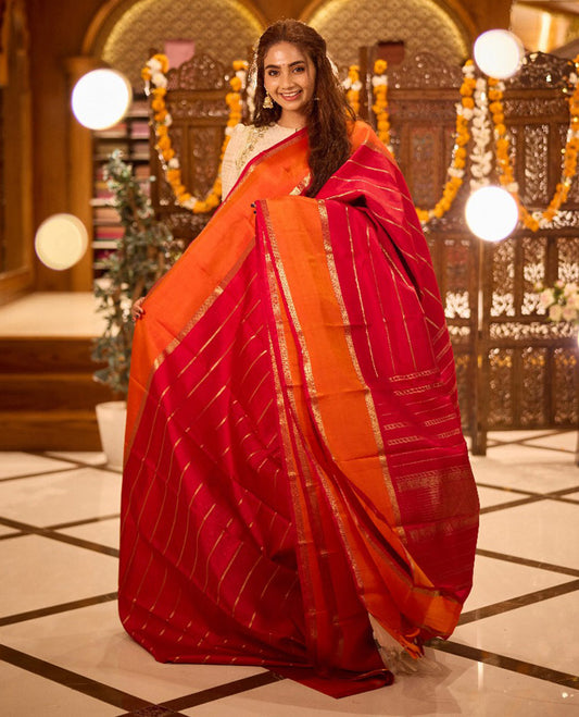 Red lavangam zari buttas woven kanchipuram silk saree, contrast rettai pettu border of thilakam,muthu and rudraksham designs, and zari-rich traditional motifs steeped pallu