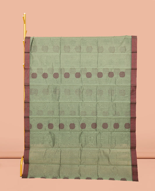 Green Semi-Silk Cotton Saree, Adorned with Round Buttas on Its Body, Complemented by a Contrast Thread Traditional Motifs Woven Border, Jaal Design Pallu, and Paired with a Contrast Blouse
