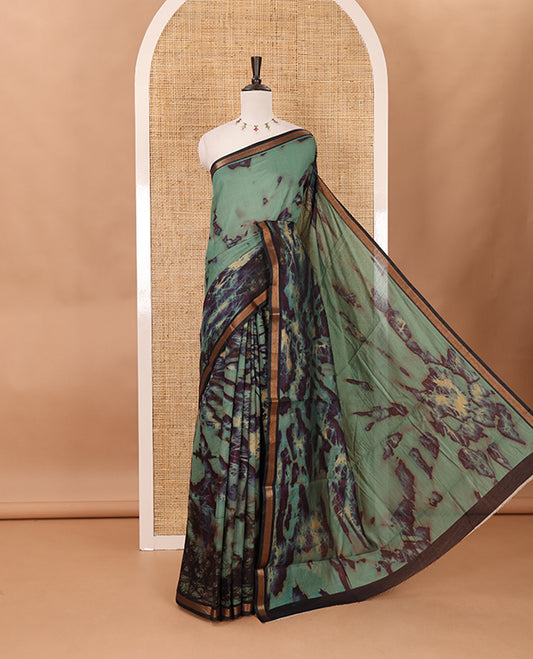 Sea blue shibori-style printed muslin saree, contrast zari piping border, self printed pallu & shibori-style printed blouse