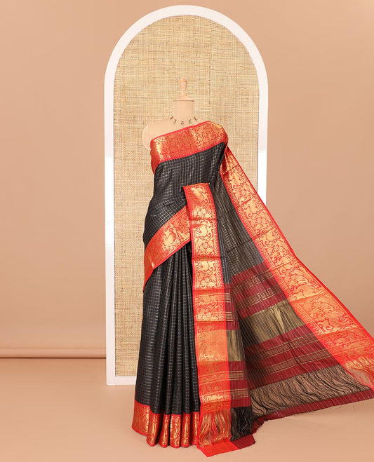 Black golden zari checked semi-taffeta saree, contrast zari border of deer and peacock motifs, striped pallu, and a contrast zari design blouse