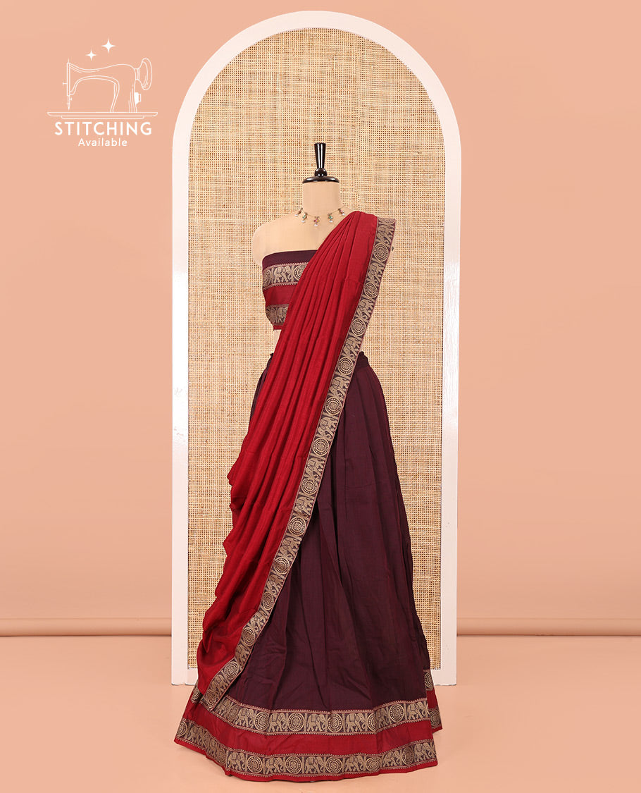 Wine-Red Mercerised Cotton Half-Saree Half-Saree Features Plain with Contrast Rettai Pettu Elephant-Chakram Bordered Skirt, Paired with a Matching Blouse, and Comes with a Contrast Elephant-Chakram-Bordered Dhavani