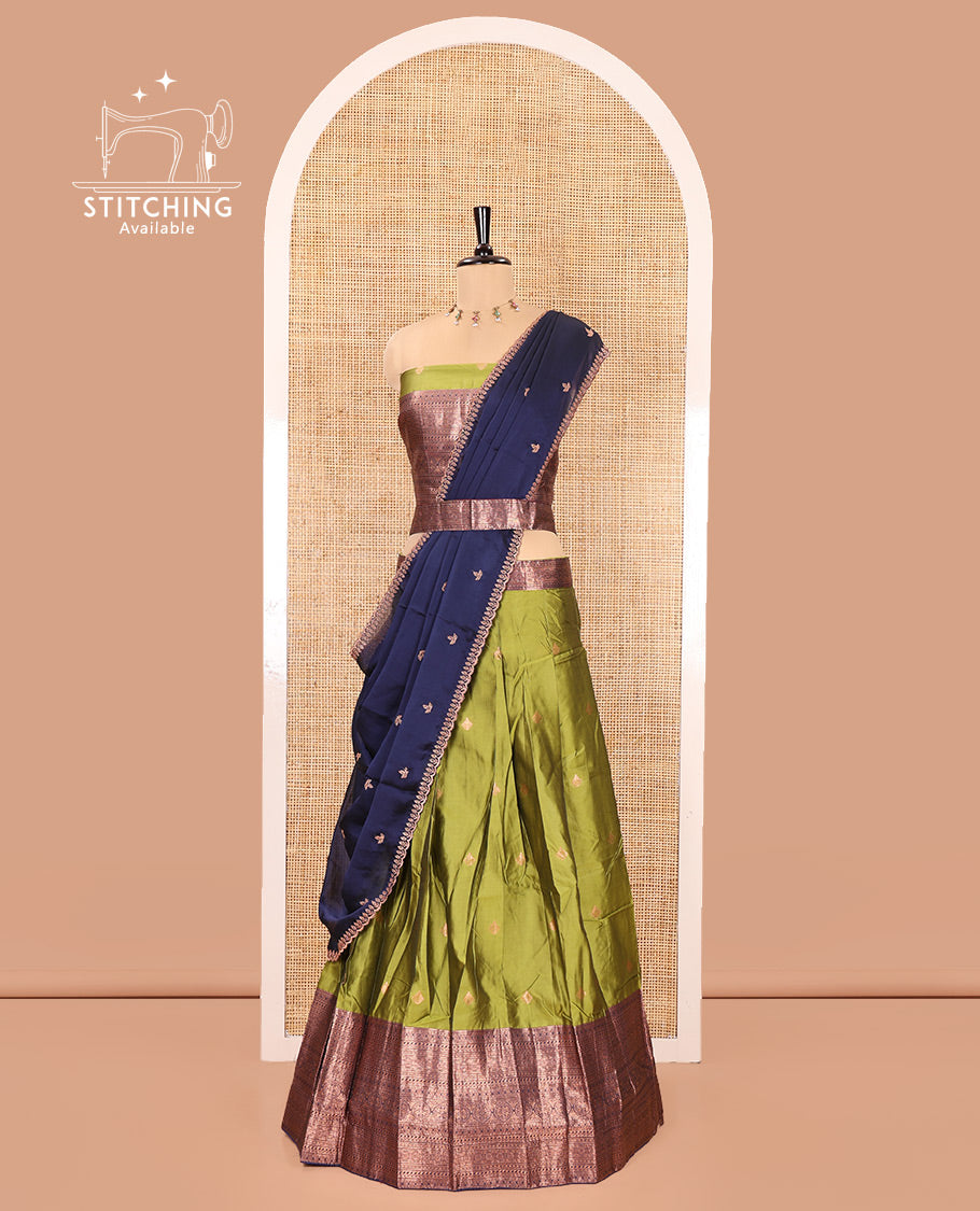Green and Navy Blue Semi-Banarasi Half-Saree, Ornamented with Zari Buttas on Its Skirt, Complemented by a Contrast Traditional Zari Designs Woven Border, Paired with a Matching Blouse, and a Contrast Satin Georgette Embroidered Scallop Dhavani