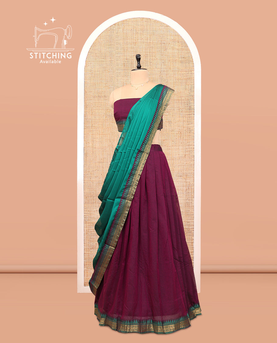 Purple Cotton Half-Saree Features Plain Skirt, a Contrast Temple Border, a Matching Blouse, and a Contrast Dhavani