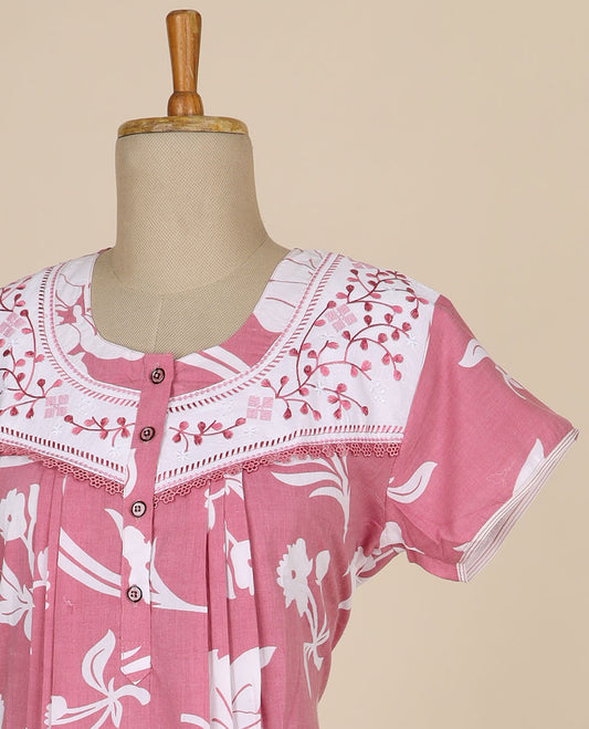 Pink floral printed and floral thread embroidery round neck cotton half sleeve nighty.