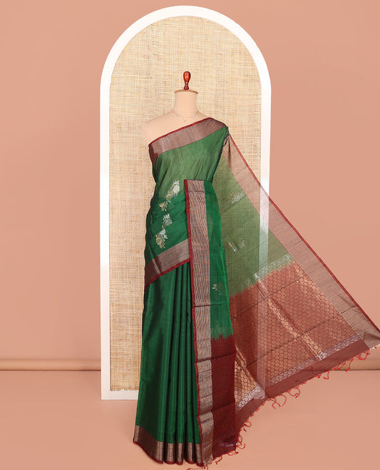Green Silk Cotton Saree, Adorned with Floral Buttas All Over Its Body, Complemented by a Contrast Zari Striped Border, Pallu of Jaal Designs, and Paired with a Contrast Blouse