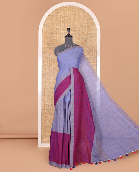 Borderless navy blue tri-ombre-colored plain khadi mul cotton saree with self-pallu, multi-colored tassels and a matching blouse