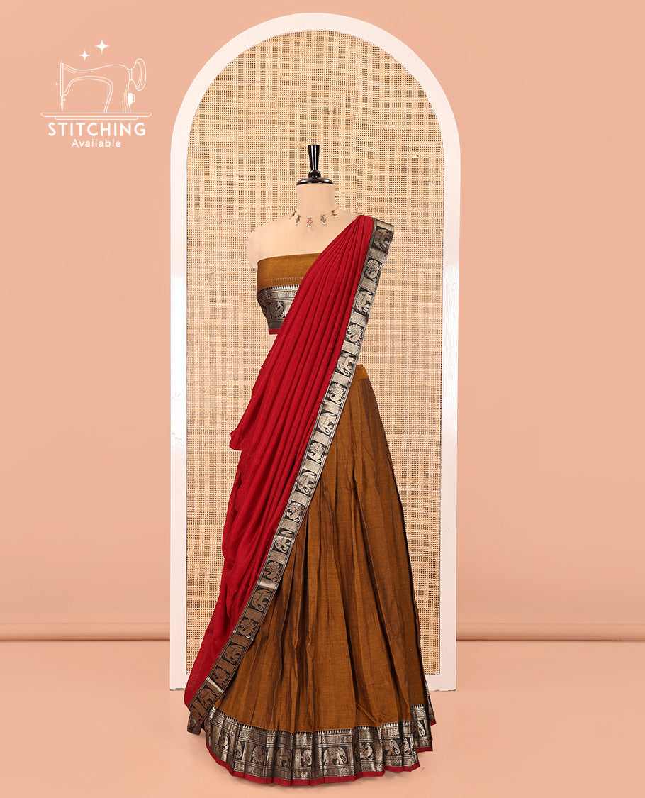 Mustard-Red Mercerised Cotton Half-Saree Features Plain with Contrast Traditional Zari Bordered Skirt, Paired with a Matching Blouse, and Comes with a Contrast Bordered Dhavani
