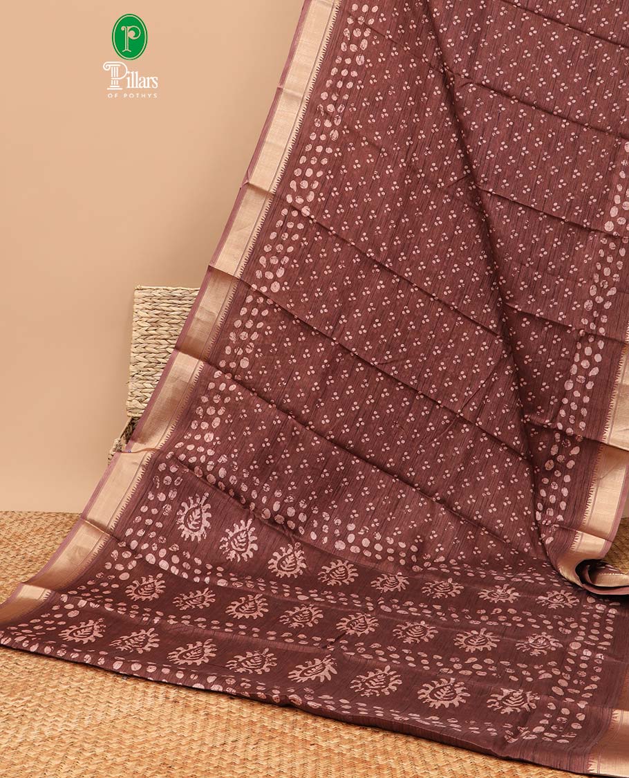 Brown all over batik printed semi-tussar saree with self zari jacquard border