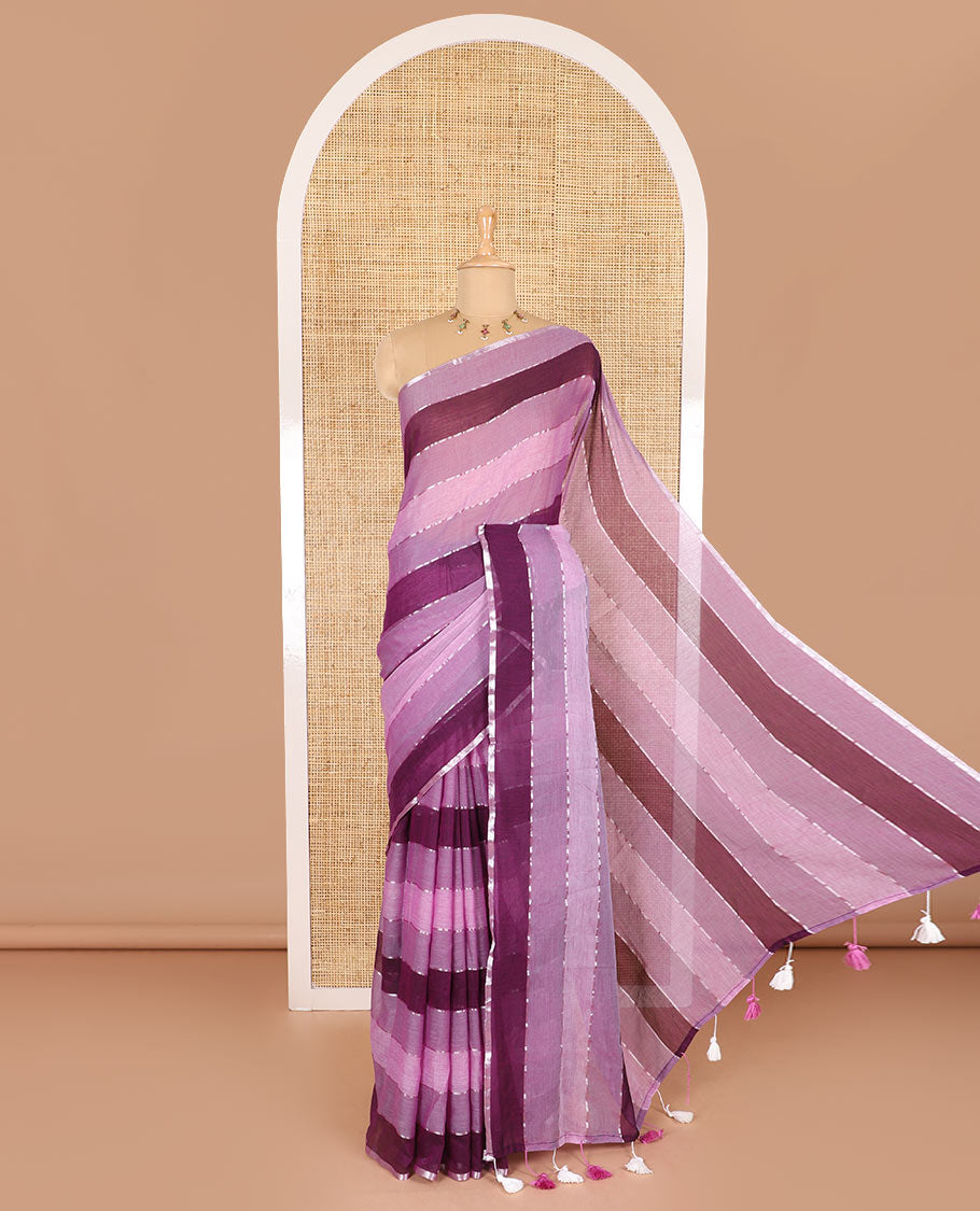 Magenta ombre-colored striped khadi mul cotton saree, zari piping border, striped pallu, and a matching striped blouse