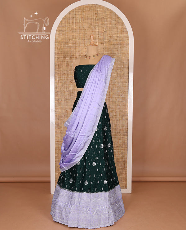 Dark Green half-saree, floral motifs embroidered semi raw silk top, matching embroidered blouse, and contrast scallop embroidered georgette dhavani