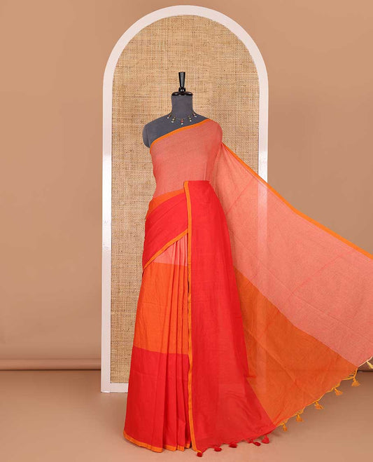 Borderless orange tri-ombre-colored plain khadi mul cotton saree with self-pallu, multi-colored tassels and a matching blouse