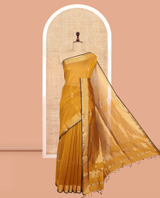 Mustard Maheshwari Cotton Saree, Adorned with Buttas, a Traditional Zari Border, Gleaming Zari Pallu, and a Matching Blouse