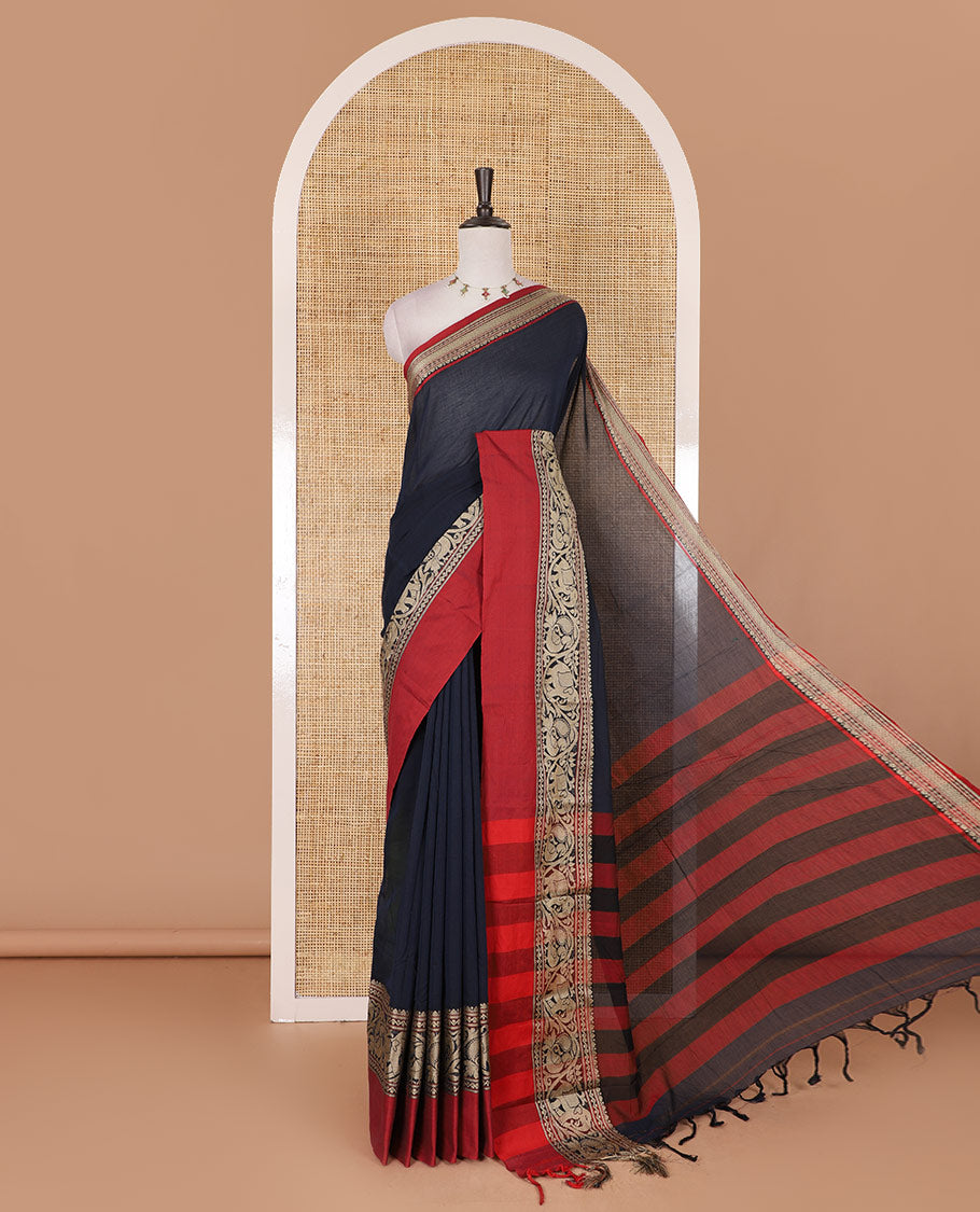 Navy blue plain mercerised cotton saree, contrast traditional border of peacock, and elephant motifs, striped pallu, and a matching blouse