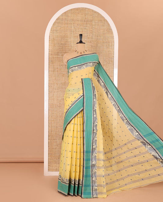 Yellow buttas Bengal cotton saree, contrast jamdani floral creeper design, and pallu of stripes, and buttas