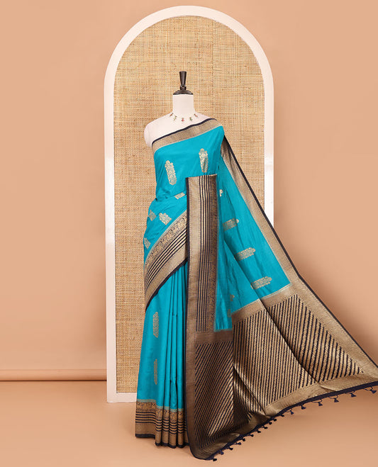 Peacock blue floral zari buttas dola silk saree, contrast traditional zari peacock border, diagonal floral zari striped pallu & contrast jacquard blouse