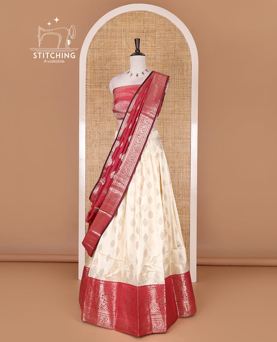 Cream with rani pink semi-banarasi half-saree, zari buttas with contrast traditional zari border skirt, zari jacquard blouse, and zari design dhavani