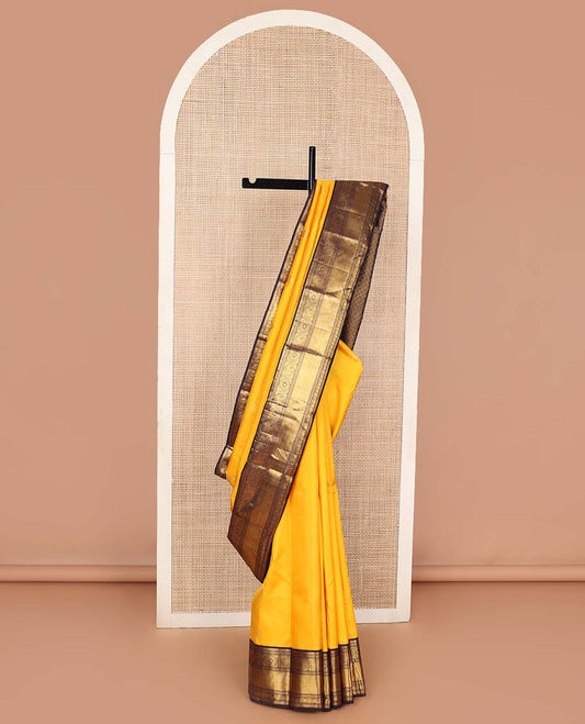 Yellow annam chakram buttas Kanchipuram korvai silk saree, contrast neer korvai border of thilakam mokku,muthu,diamond,round yaanai, chakram, and mayil kann, and pallu of poun designs