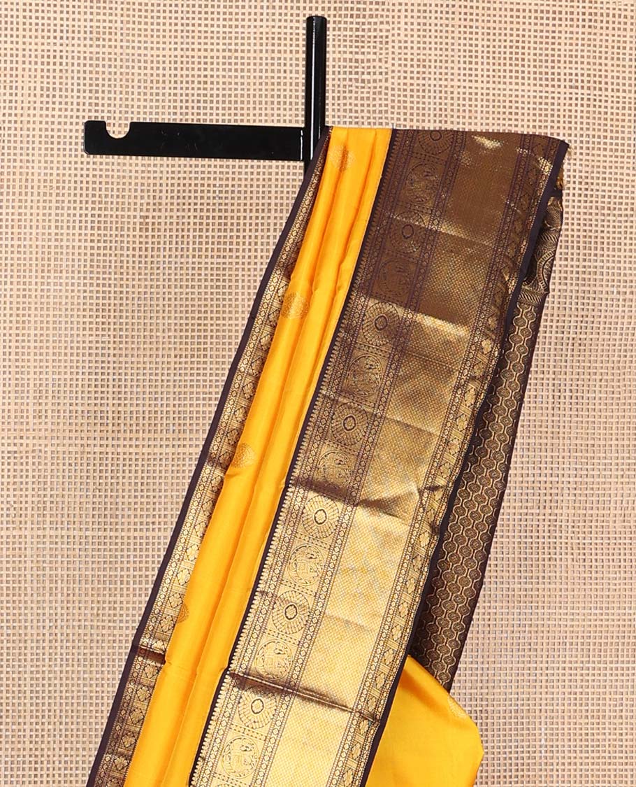 Yellow annam chakram buttas Kanchipuram korvai silk saree, contrast neer korvai border of thilakam mokku,muthu,diamond,round yaanai, chakram, and mayil kann, and pallu of poun designs
