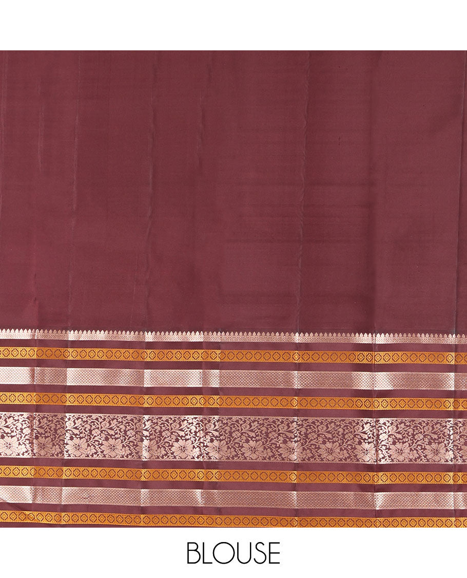 Orange Vasundhara Silk Saree, Adorned with Annam Chakram Buttas All Over Its Body, Complemented by Contrast Border of Thilakam, Neli, Laddu Kamalam, Mayil Kann, and Kodi Visiry Designs, Pallu of Butta Enclosed Checks, and Paired with a Contrast Blouse