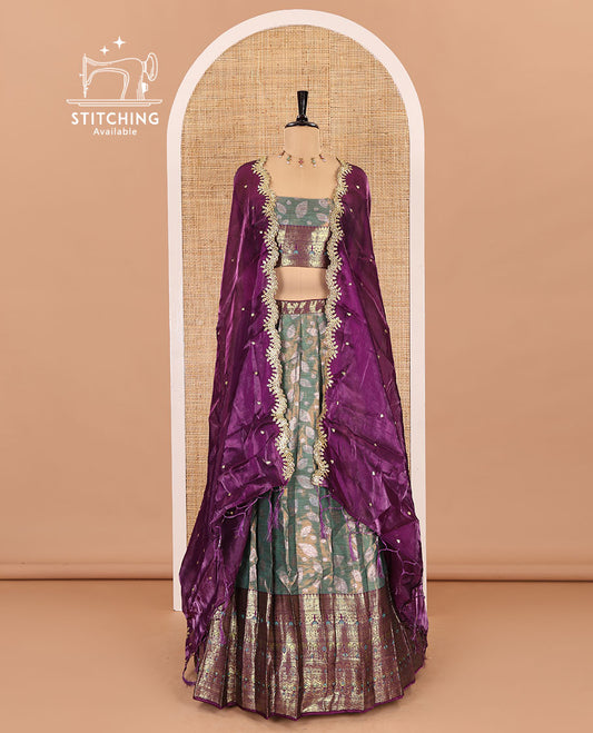 Green and wine half-saree, leaf jacquard with contrast traditional bordered banarasi tissue skirt, a matching blouse, and a contrast scallop embroidered fendi organza dhavani