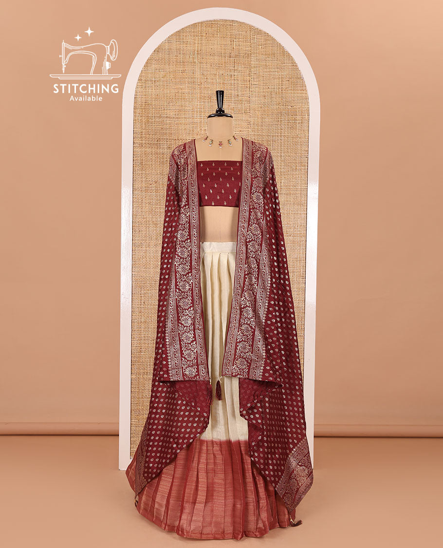Cream-maroon Vichitra half-saree, plain and contrast bordered skirt, contrast leaf buttas blouse, dhavani of buttas and floral creeper designs