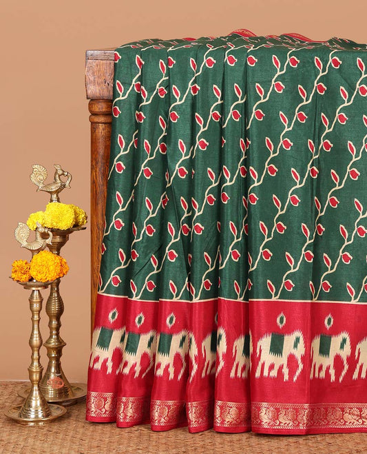 Green floral vine printed Assam cotton saree,contrast border of ikat elephant print & zari peacocks,ikat jaal pallu & ikat print blouse