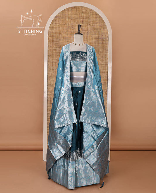 Bottle green-blue taffeta silk half-saree, zari buttas & contrast floral-geometric zari border skirt, zari woven blouse & contrast zari woven dhavani