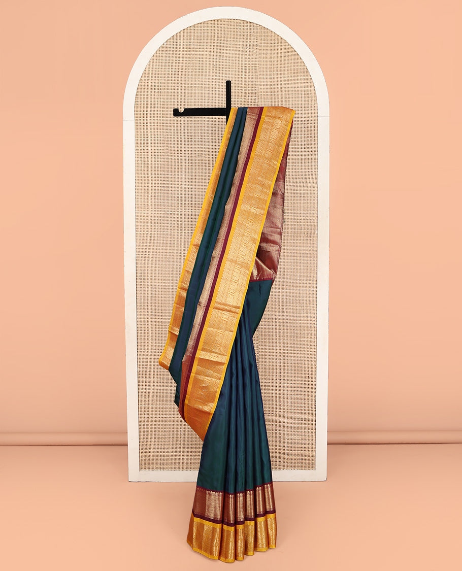 Blue Plain Kanchipuram Silk Saree, Complemented by a Contrast Border of Muthu, Vanki, Rekku, Neli, and Iruthalai Pakshi Designs, Gleaming Jaal Pallu, and Paired with a Contrast Blouse