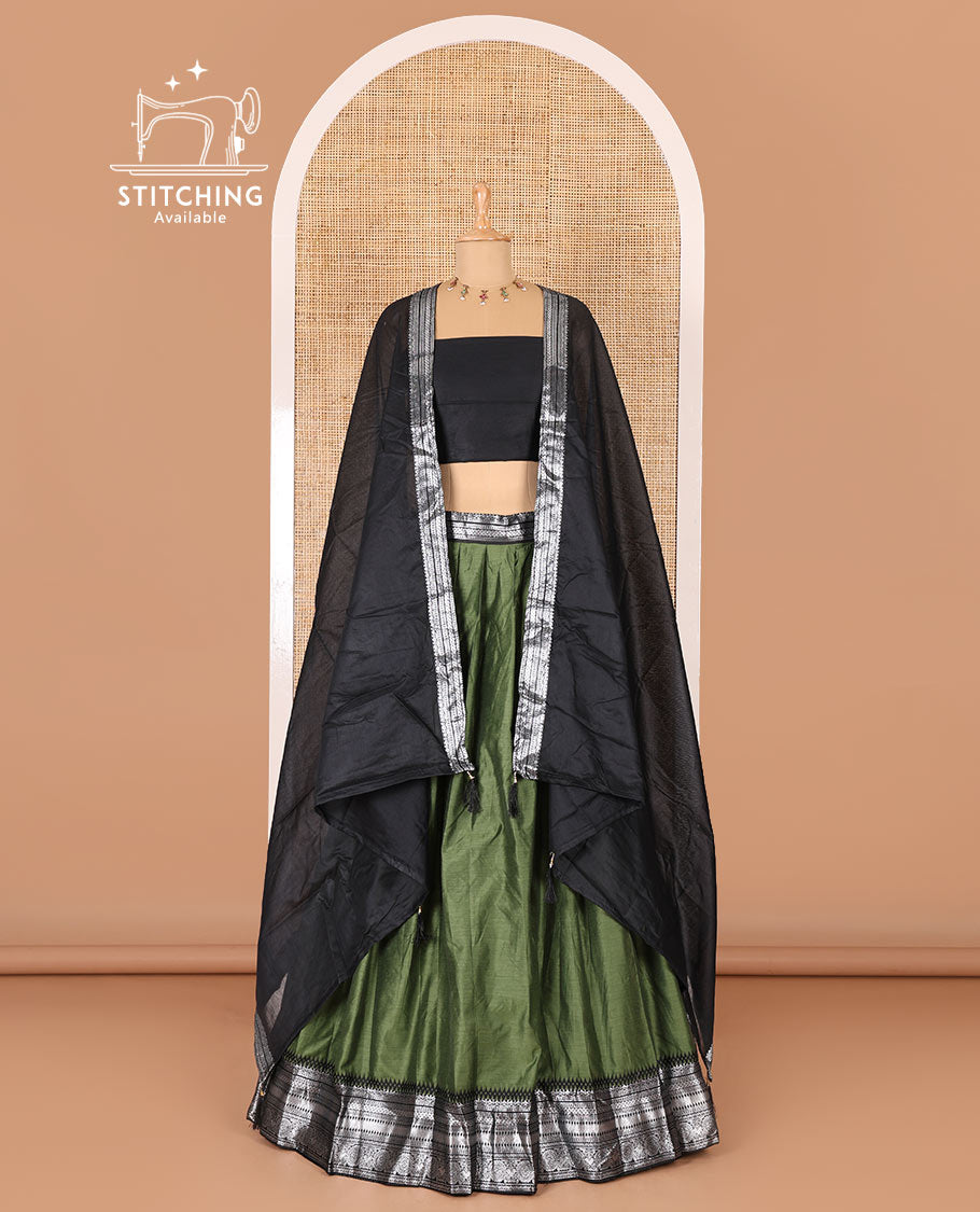 Green taffeta silk half-saree, plain with a contrast traditional design bordered skirt, contrast blouse, and traditional zari bordered blouse