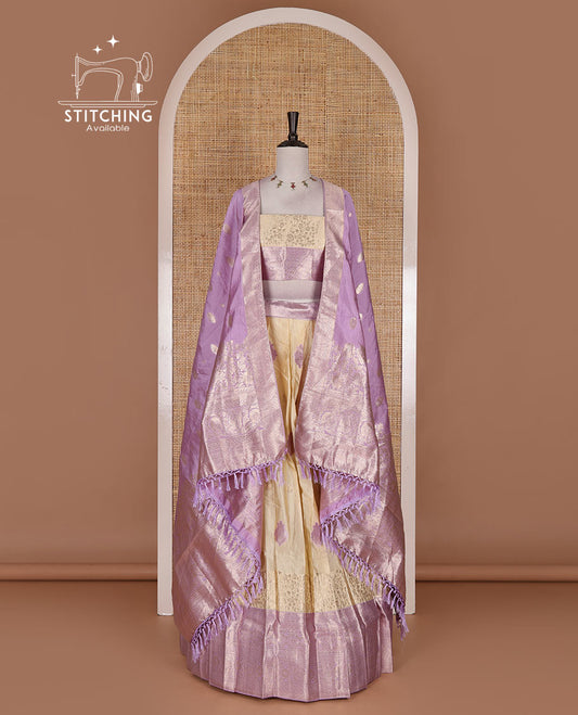 Cream taffeta silk half saree, meena buttas skirt, contrast lavender traditional zari border, matching blouse, and zari woven dhavani