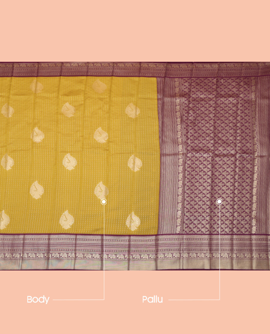Mustard Litchi Saree, Gleamed Up with Zari Buttas and Checks, a Contrast Traditional Zari Border, Grand Pallu, and a Contrast Blouse
