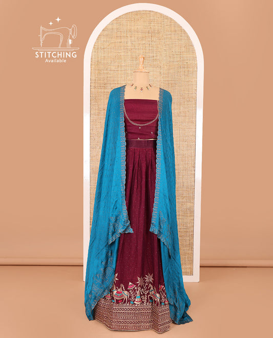 Wine half-saree, Swarovski stone work with girl-on-the-horse motifs embroidered bordered satin georgette skirt, a matching satin georgette blouse, and a contrast Swarovski stone work scallop dhavani