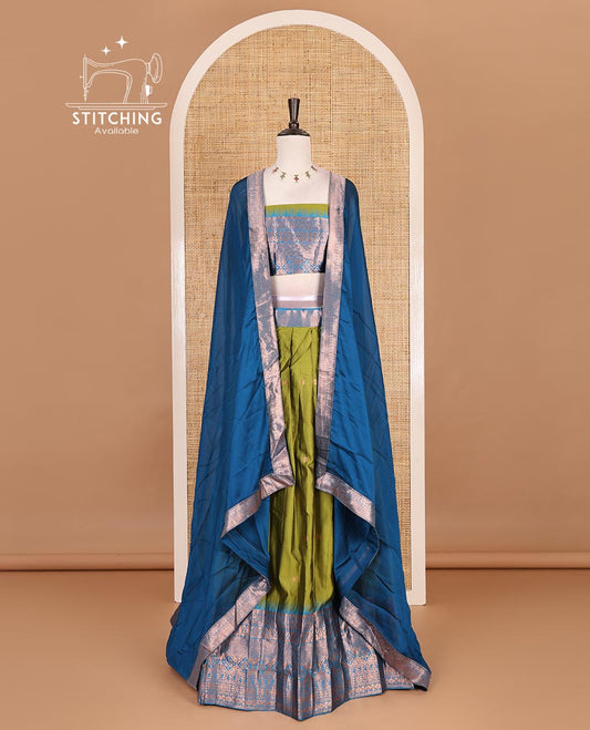 Green taffeta silk half saree, zari buttas with contrast blue traditional zari border skirt, matching zari design blouse, and contrast plain zari border syska georgette dhavani