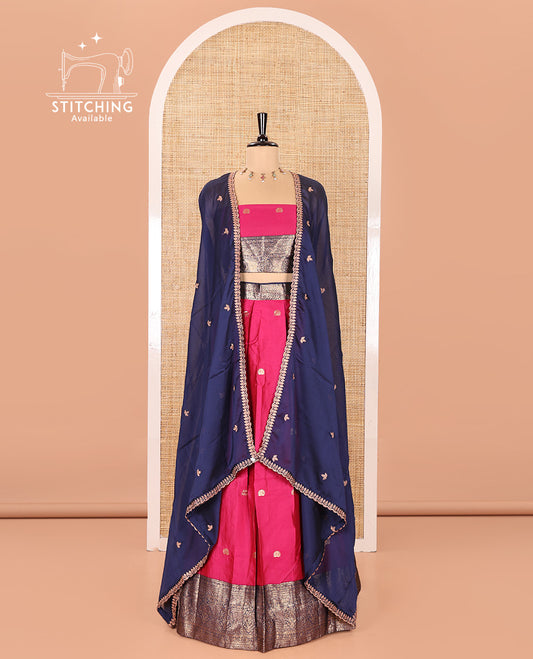 Pink and Navy Blue Semi-Banarasi Half-Saree, Adorned with Zari Buttas on Its Skirt, Complemented by a Contrast Traditional Zari Designs Woven Border, Paired with a Matching Blouse, and a Satin Georgette Embroidered Scallop Dhavani