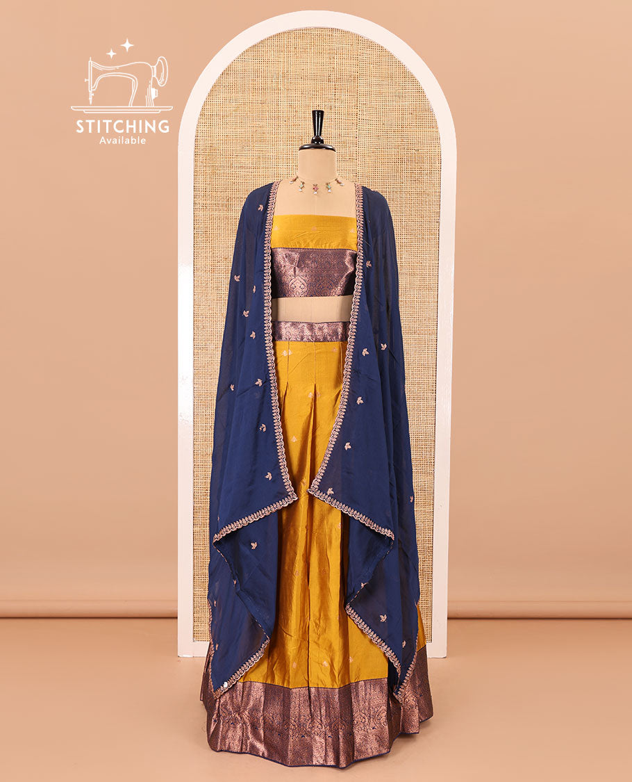 Mustard taffeta silk half-saree, zari buttas with contrast traditional zari bordered skirt, matching zari design blouse, and contrast scallop buttas embroidered dhavani