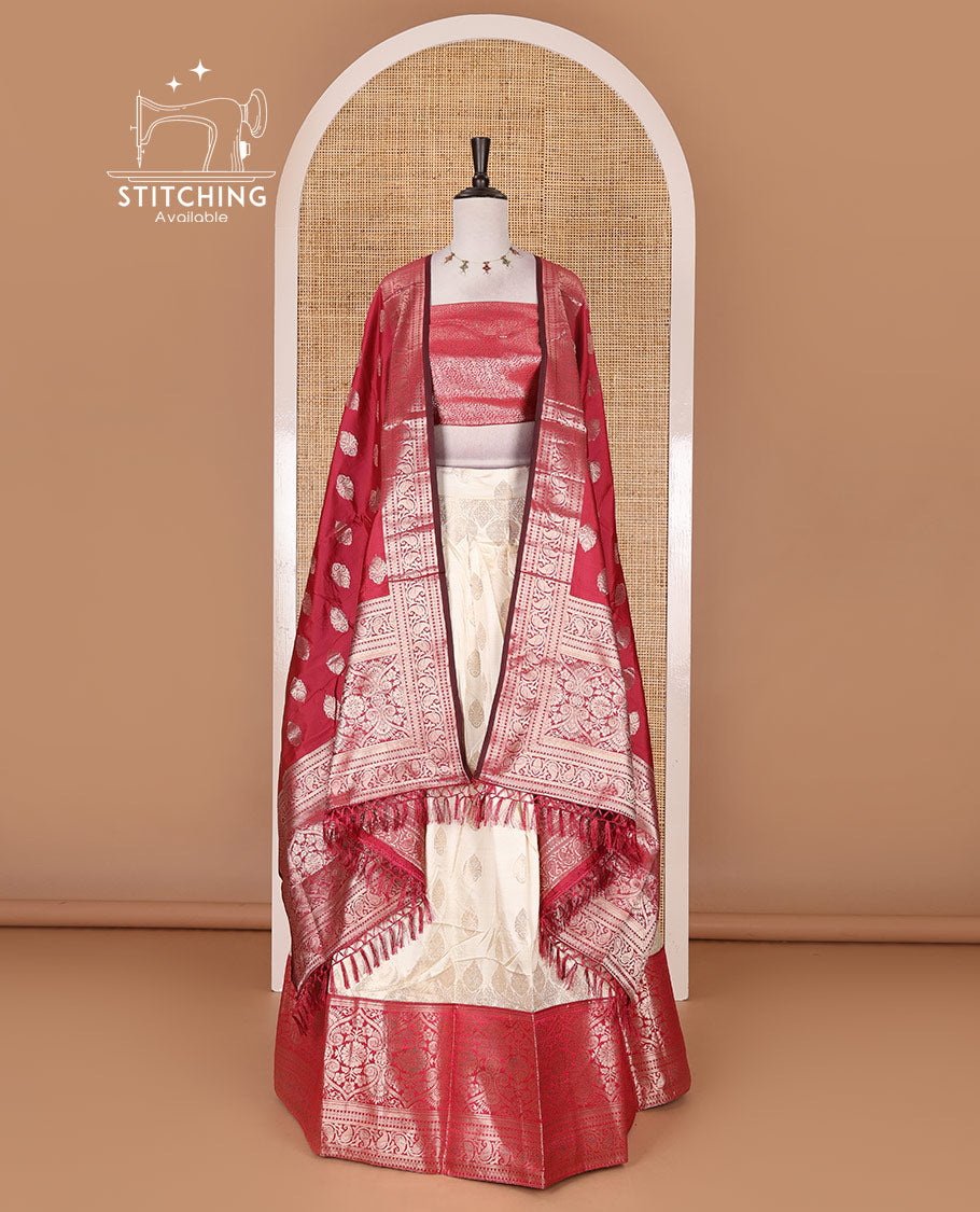 Cream with rani pink semi-banarasi half-saree, zari buttas with contrast traditional zari border skirt, zari jacquard blouse, and zari design dhavani