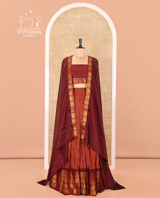 Rust and Maroon Plain Sungudi Cotton Half-saree, Complemented by Captivating Contrast Traditional Zari Border of Temple, Peacock, and Elephant Designs, Paired with a Contrast Zari Checked Blouse, and Comes with a Zari-Bordered Vichitra Silk Dhavani
