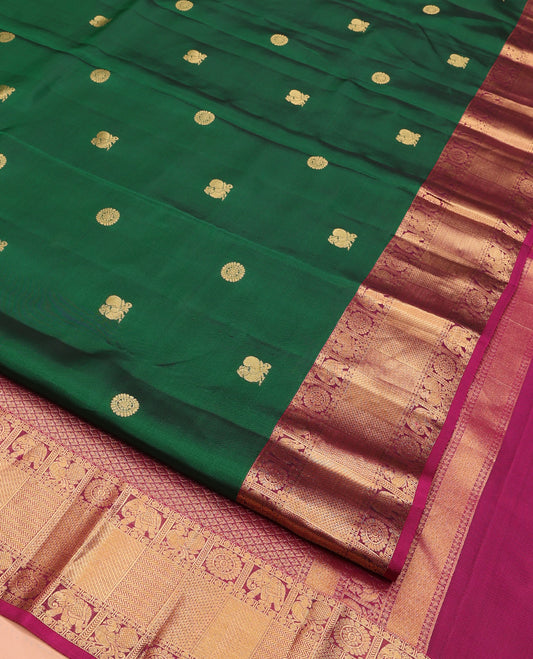 Green Vasundhara Lite Silk Mix Saree, Richly Detailed with Mayil and Chakram Buttas All Over Its Body, Complemented by Contrast Border of Rudraksham, Chakram, Yaanai, Mayil, Vanki, and Ara Maadam Designs, Grand Jaal Pallu and Paired with a Contrast Blouse