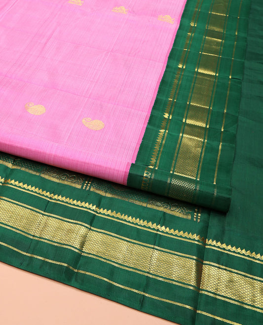 Pink Kanchipuram Silk Saree, Adorned with Manga and Mayil Buttas, Complemented by Contrast One-Sided Korvai Border of Thilakam Mokku, Banaras, and Kuyil Kann Designs, Pallu Steeped with Mayil Designs, and Comes Without a Blouse