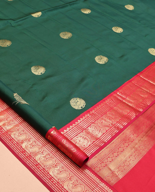 Green Vasundhara Lite Silk Mix Saree, Adorned with Mayil Buttas, a Contrast Border of Thilakam Mokku, Banaras, Kathir, and Mayil Designs, Jaal Pallu, and a Contrast Blouse