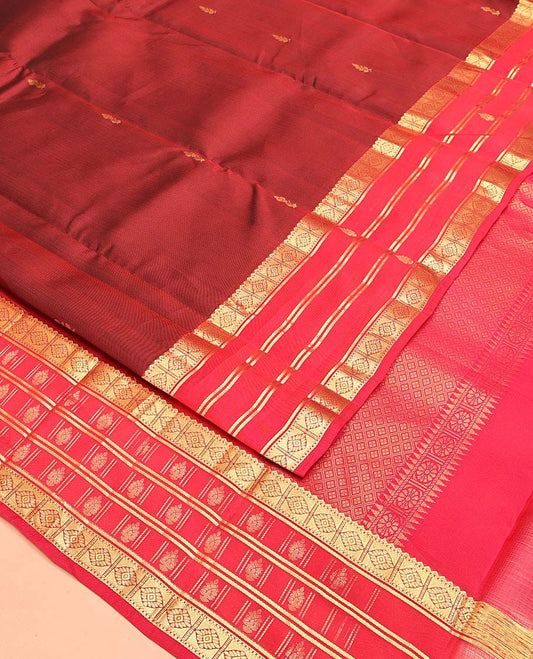 Maroon Vasundhara Lite Silk Mix Saree, Decked Up with Zari Buttas All Over Its Body, Complemented by a Contrast Border of Rekku, Muthu, and Diamond Designs, Grand Jaal-Design Pallu, and Paired with a Contrast Blouse