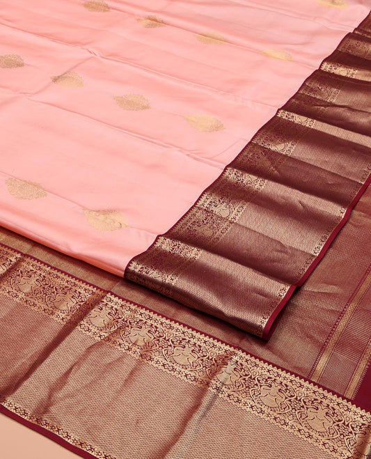 Pink Vasundhara Silk Saree, Adorned with Zari Buttas All Over Its Body, Complemented by a Contrast Border of Rekku, Iruthalai Pakshi, and Mayil Kann Designs, Grand Jaal-Patterned Pallu, and Paired with a Contrast Blouse