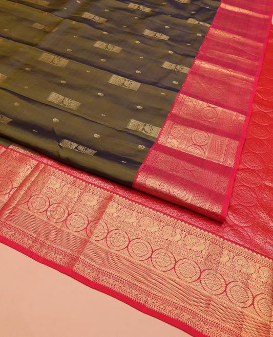 Green Vasundhara Silk Saree, Elevated with Zari Buttas on Its Body, Complemented by a Contrast Border of Thilakam Mokku, Muthu, Ara Maadam, Paisa, Kodi Visiry, and Annam Chakram Designs, Grandly Zari-Woven Pallu, and Paired with a Contrast Blouse