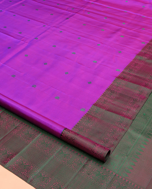 Purple Kanchipuram Silk Saree, Adorned with Diamond and Mayil Thread Buttas on Its Body, Complemented by a Contrast Border of Thilakam Mokku, Iruthalai Pakshi, and Kuyil Kann Designs, Pallu of Jaal Designs, and Paired with a Contrast Blouse