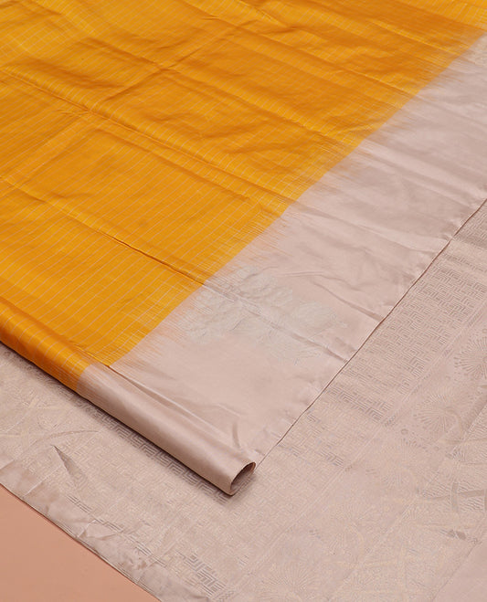 Yellow checked Kanchipuram silk saree, contrast border of zari buttas, and pallu of geometric patterns