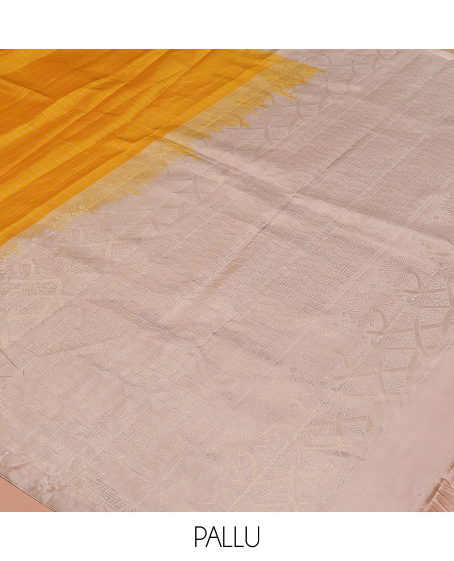 Yellow checked Kanchipuram silk saree, contrast border of zari buttas, and pallu of geometric patterns