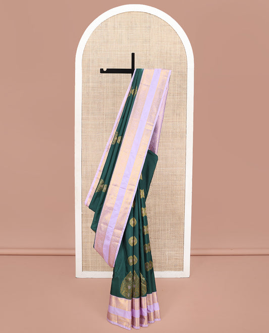 Green Budget Silk Saree, Gracefully Embellished with Meena Buttas All Over Its Body, Complemented by Contrast Traditional Zari Design Rettai Pettu Border, Intricately Designed Pallu, and Paired with a Contrast Blouse